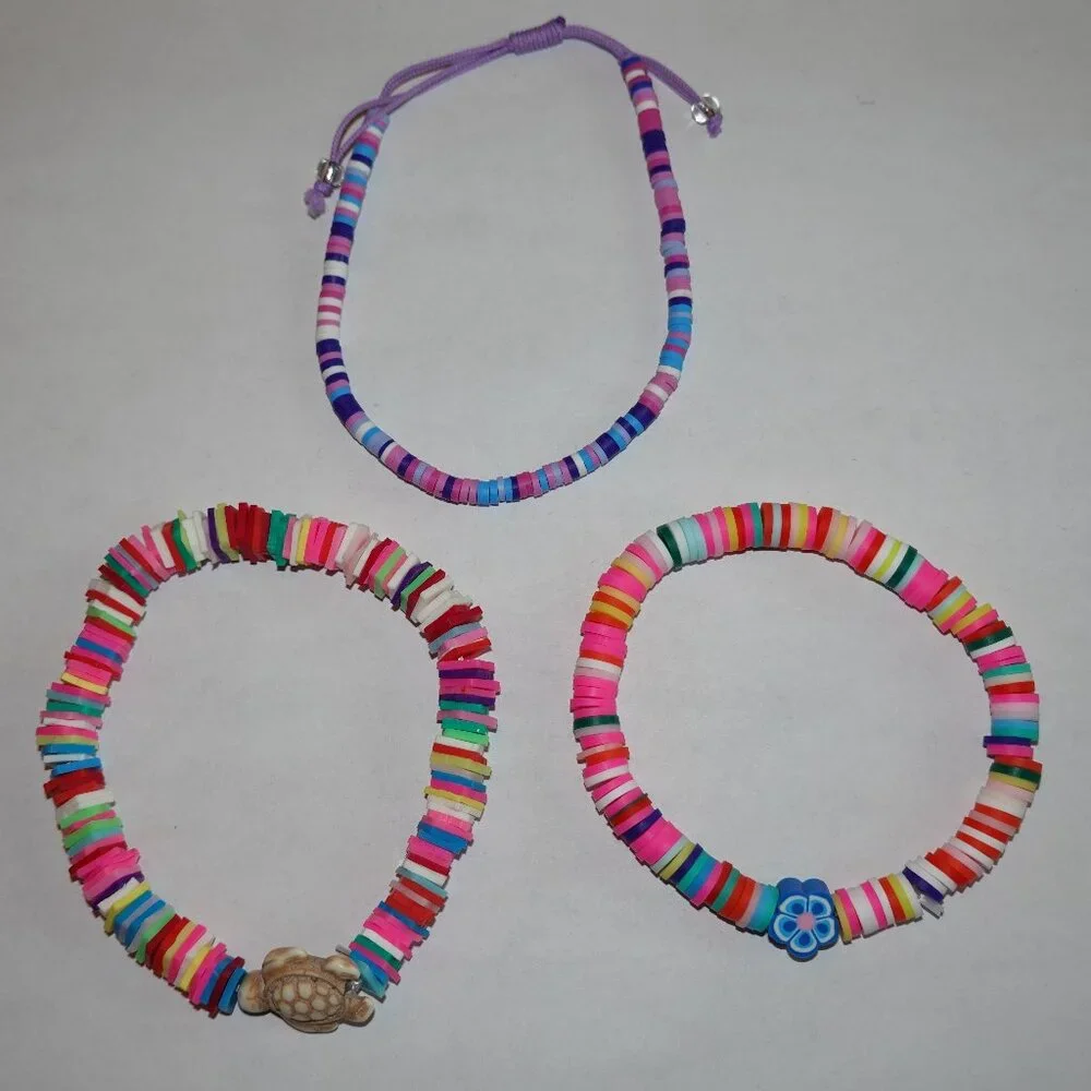 Set of 3 colorful clay bead bracelets - turtle, blue flower, purple - like new